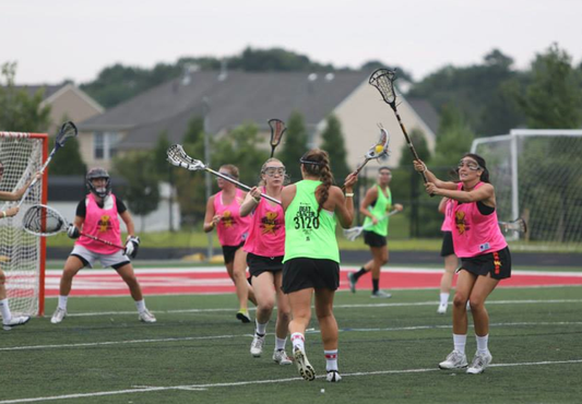 Womens' College Lacrosse Stars Stand Up Against Cancer at WBLC